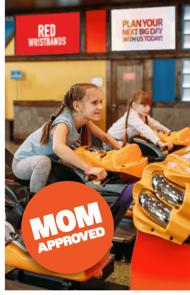 Girl riding arcade with mom approved