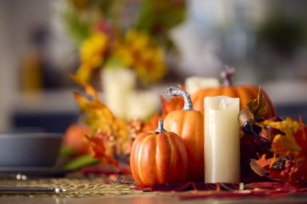 Autumn Or Fall Table Decoration At Home With Pumpkins Candle And Leaves