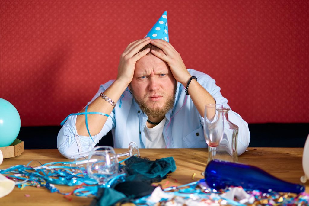Holiday Hangover - Man in a blue hat