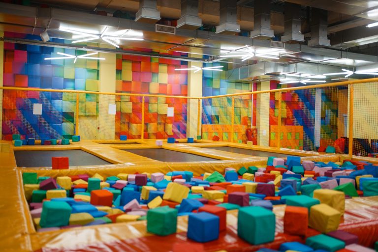 Kids trampoline and soft cubes on playground