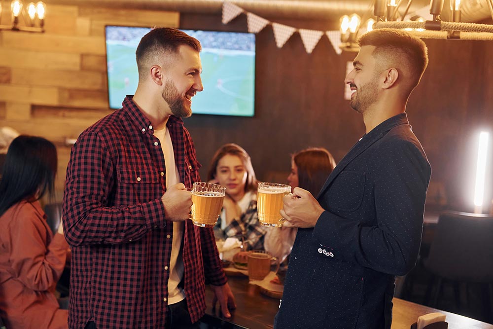 Atmosphere in a bar. People having a drink