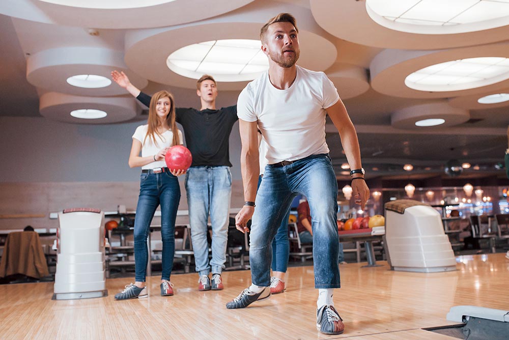 People watching for a strike at bowling