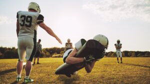 Football players practicing outside