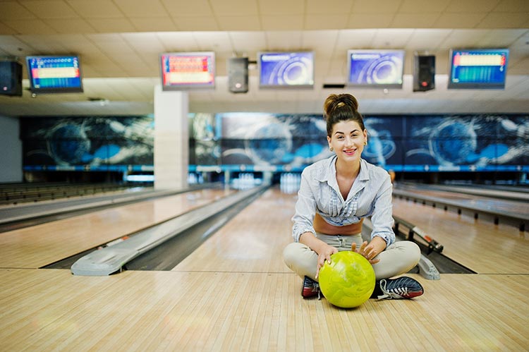 Girl With Bowling Ball on Lane