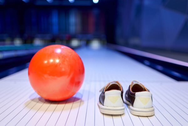 Ball and shoes on bowling lane