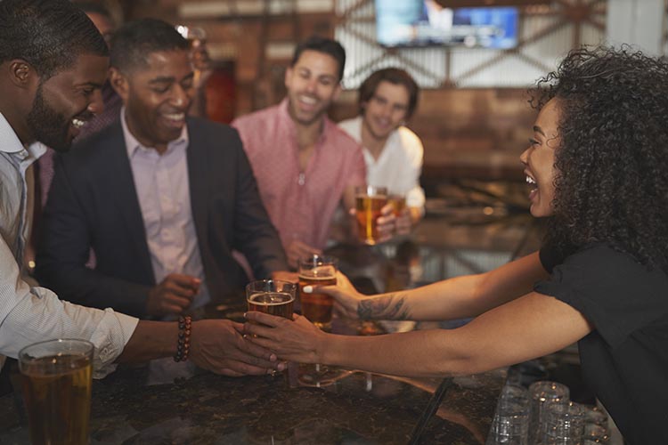 Waitress serving some drinks for the big game