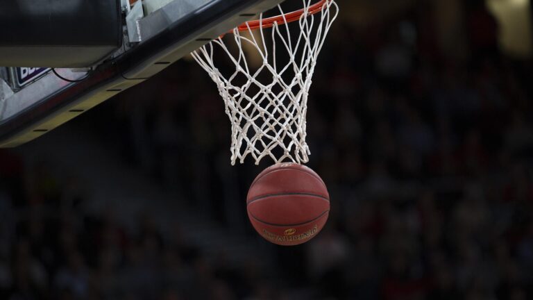 Basketball close to rim just having gone in