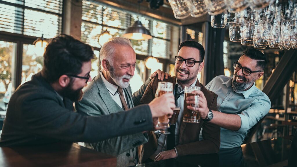 Dads toasting at the bar