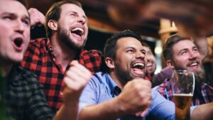 Men At a sports bar cheering