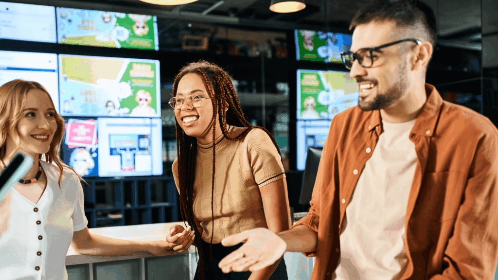People standing around a bar with digital signage in the background