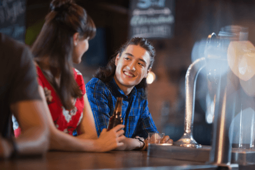 Friends Looking at each other at the bar