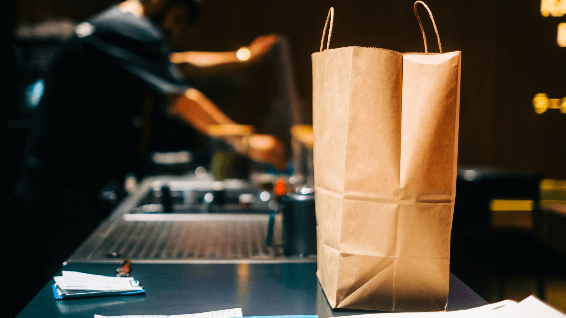 Paper bag on a commercial counter waiting for pickup