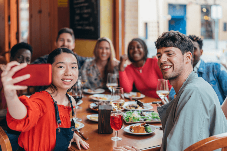 Friends at a restaurant taking a selfie