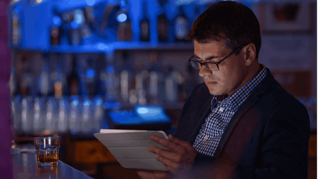 Person reading at the bar