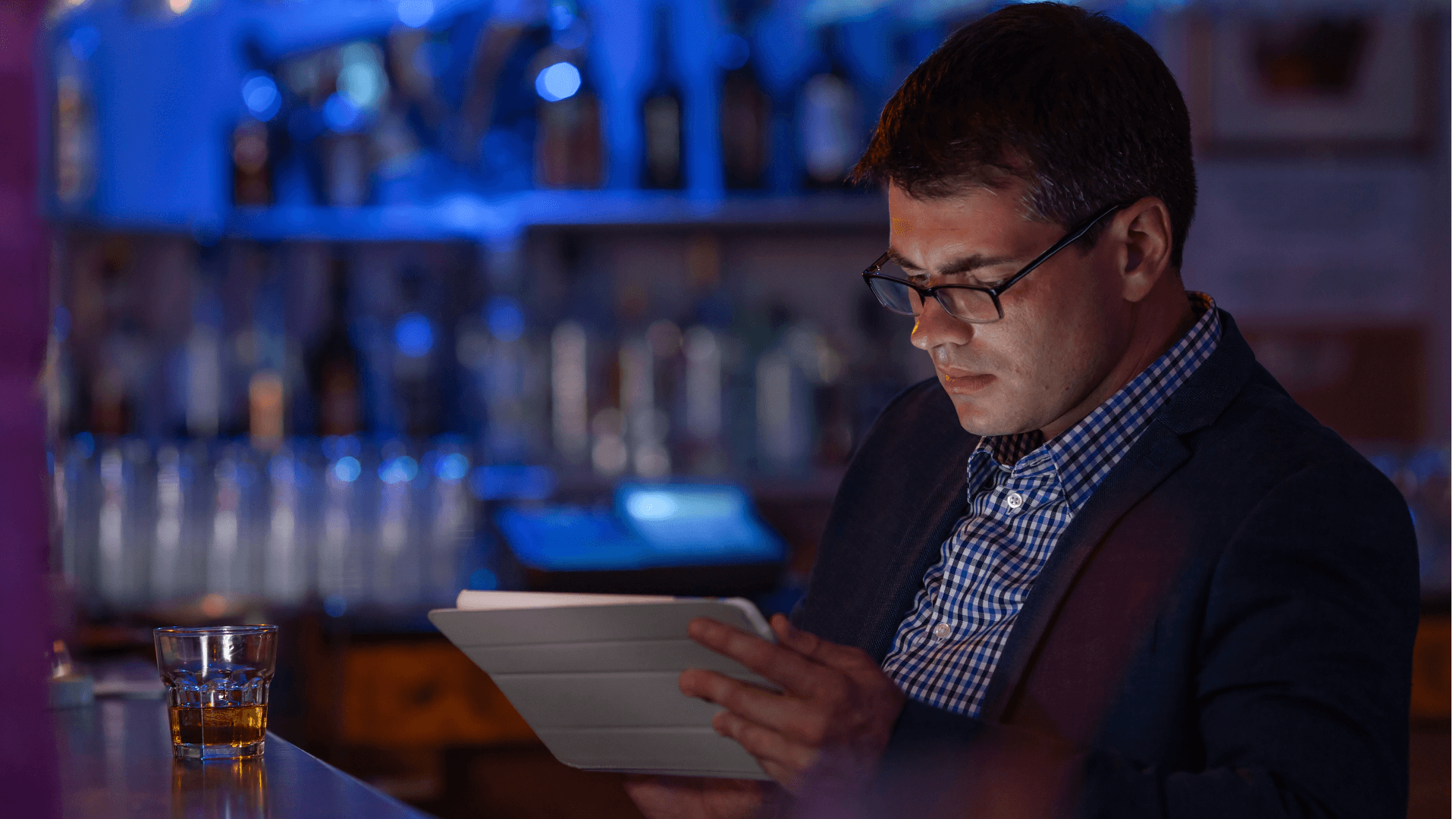 Person reading at the bar