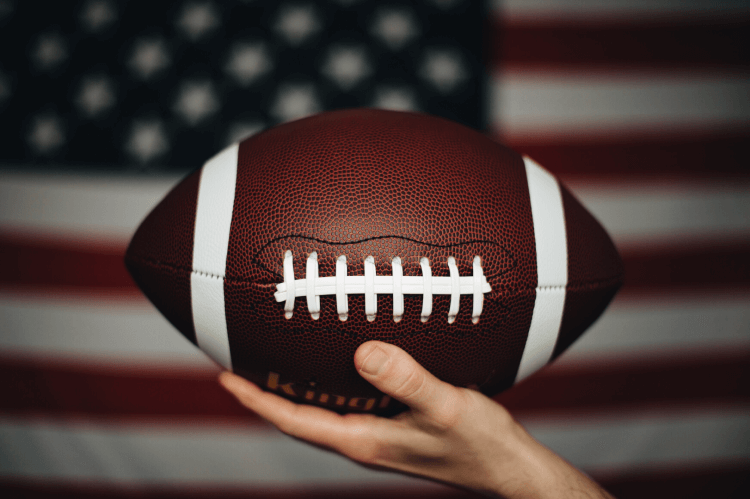 Football with American Flag in the background