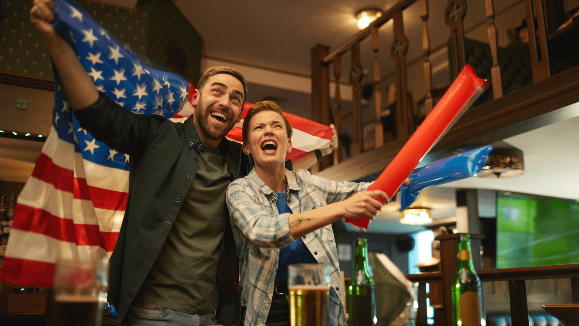 American Olympics Header (1) Man and woman at bar watching the olympics
