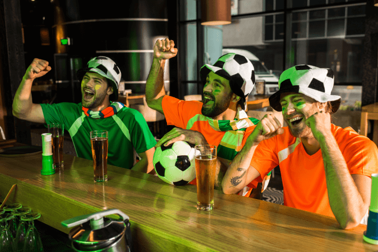 Soccer Fans watching at the bar