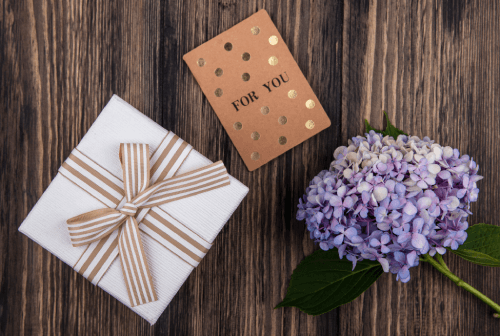 Flowers, a gift, and a card