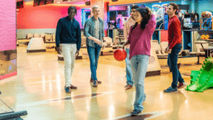Friends on a bowling lane