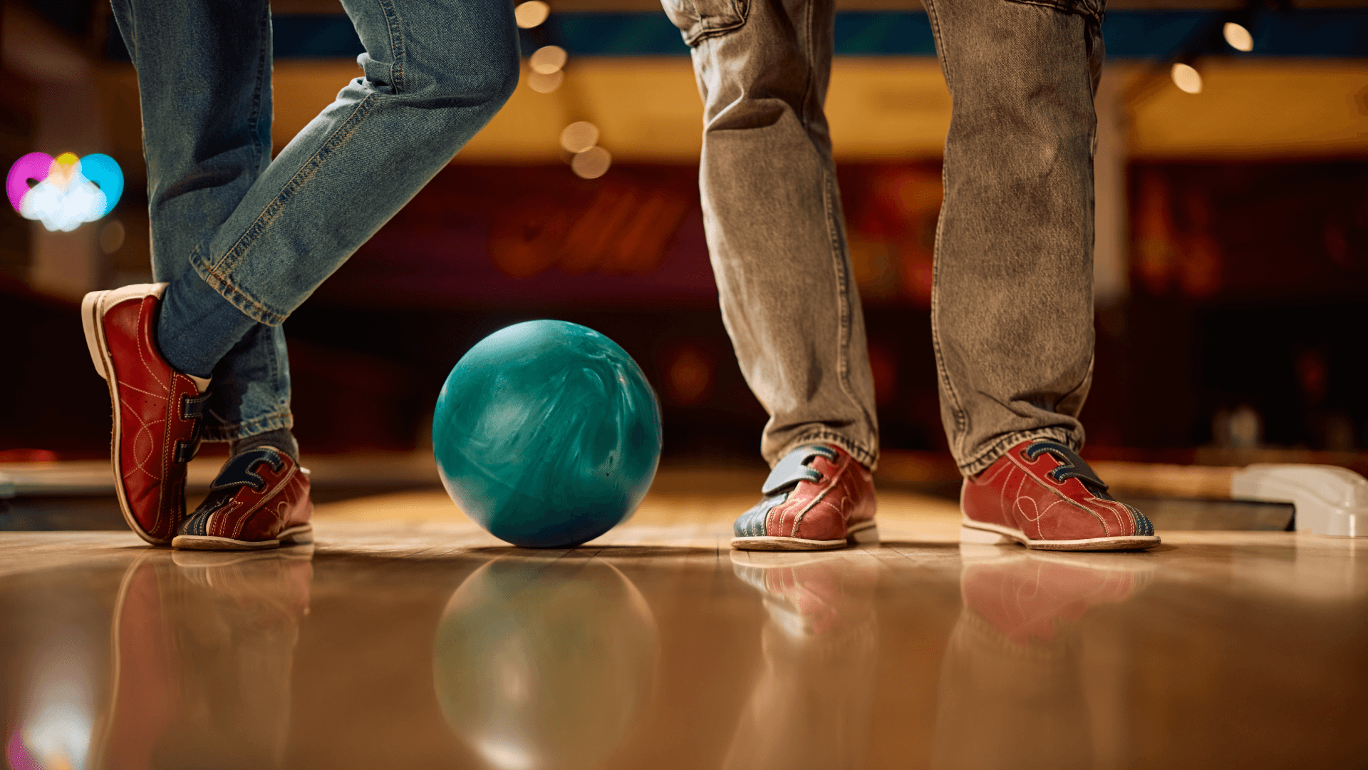 Bowling shoes and ball on a lane