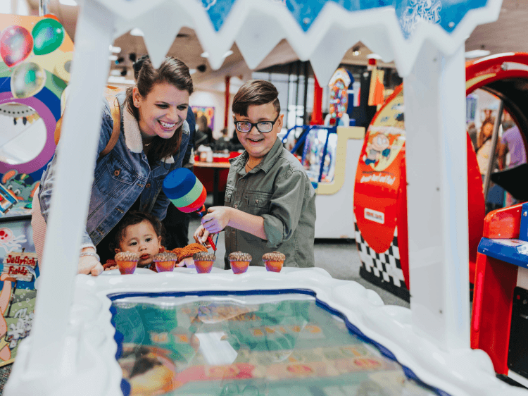 Arcade with family playing a game
