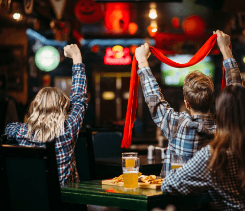 Friends supporting their team at the bar