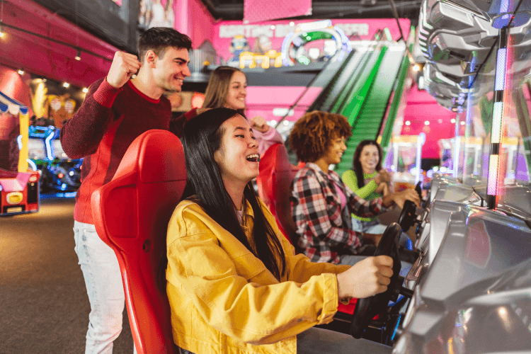 Women playing an arcade game